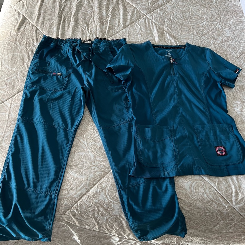 Koi lite dobby scrubs. Both sized medium. Caribbean blue.